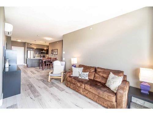 406-10 Auburn Bay Link Se, Calgary, AB - Indoor Photo Showing Living Room