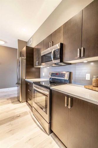 406-10 Auburn Bay Link Se, Calgary, AB - Indoor Photo Showing Kitchen