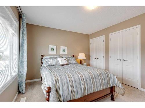 291 Reunion Green Nw, Airdrie, AB - Indoor Photo Showing Bedroom