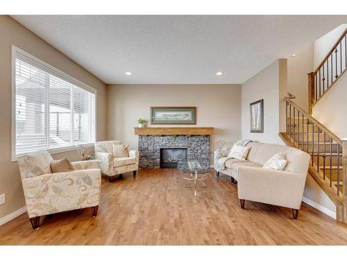 291 Reunion Green Nw, Airdrie, AB - Indoor Photo Showing Living Room With Fireplace