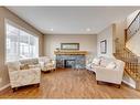 291 Reunion Green Nw, Airdrie, AB  - Indoor Photo Showing Living Room With Fireplace 