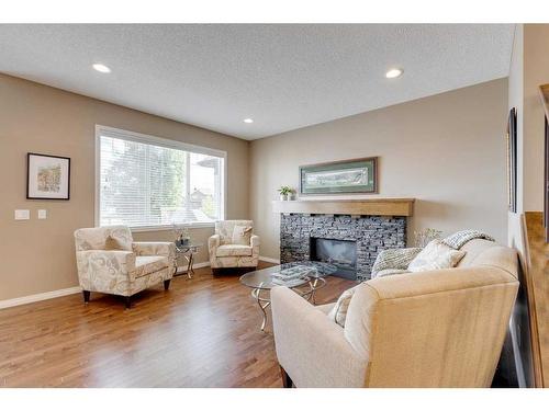 291 Reunion Green Nw, Airdrie, AB - Indoor Photo Showing Living Room With Fireplace