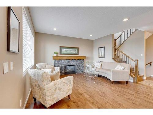 291 Reunion Green Nw, Airdrie, AB - Indoor Photo Showing Living Room With Fireplace