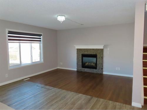 70 Saddlecrest Terrace Ne, Calgary, AB - Indoor Photo Showing Living Room With Fireplace