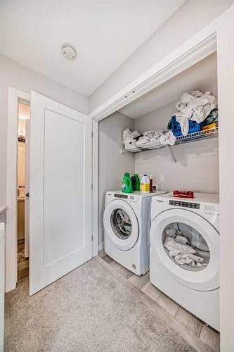 27 Tuscany Summit Square Nw, Calgary, AB - Indoor Photo Showing Laundry Room