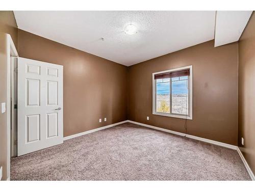 4205-92 Crystal Shores Road, Okotoks, AB - Indoor Photo Showing Other Room