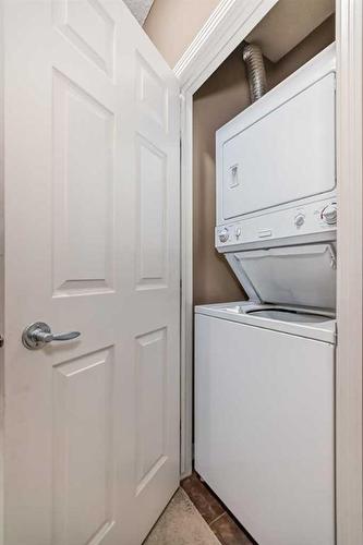 4205-92 Crystal Shores Road, Okotoks, AB - Indoor Photo Showing Laundry Room