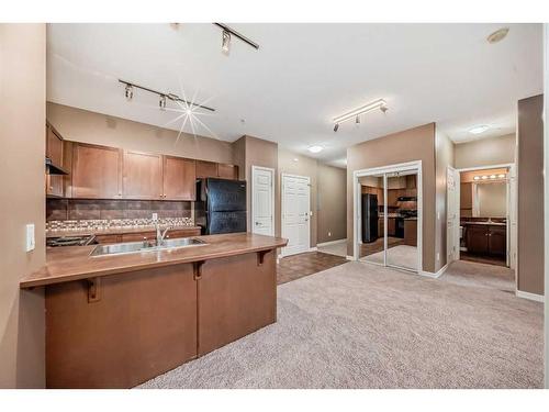 4205-92 Crystal Shores Road, Okotoks, AB - Indoor Photo Showing Kitchen With Double Sink