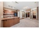 4205-92 Crystal Shores Road, Okotoks, AB  - Indoor Photo Showing Kitchen With Double Sink 