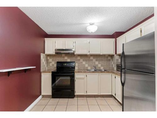 67-1155 Falconridge Drive Ne, Calgary, AB - Indoor Photo Showing Kitchen