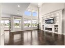 144 Kinniburgh Loop, Chestermere, AB  - Indoor Photo Showing Other Room With Fireplace 