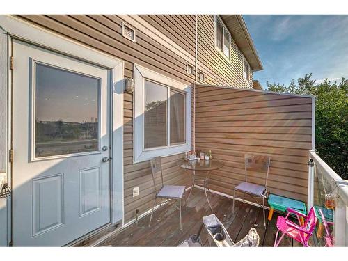 302-800 Yankee Valley Boulevard Se, Airdrie, AB - Outdoor With Deck Patio Veranda With Exterior