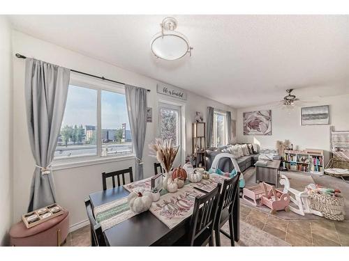 302-800 Yankee Valley Boulevard Se, Airdrie, AB - Indoor Photo Showing Dining Room