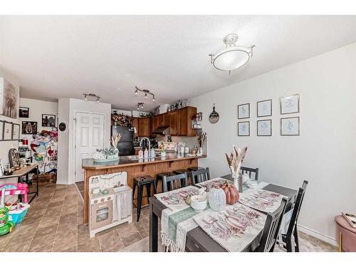 302-800 Yankee Valley Boulevard Se, Airdrie, AB - Indoor Photo Showing Dining Room