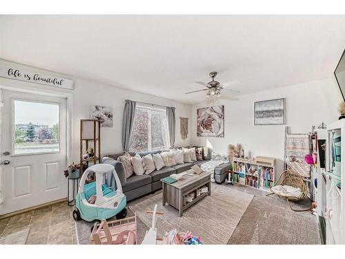 302-800 Yankee Valley Boulevard Se, Airdrie, AB - Indoor Photo Showing Living Room