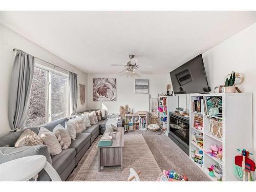 302-800 Yankee Valley Boulevard Se, Airdrie, AB - Indoor Photo Showing Living Room