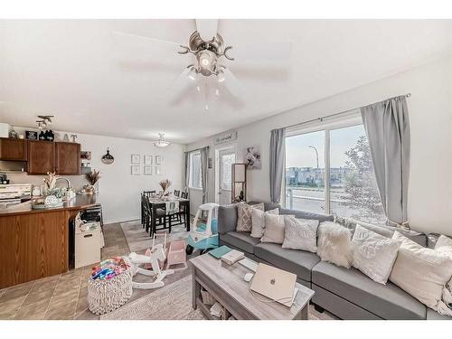 302-800 Yankee Valley Boulevard Se, Airdrie, AB - Indoor Photo Showing Living Room