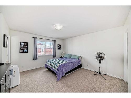 302-800 Yankee Valley Boulevard Se, Airdrie, AB - Indoor Photo Showing Bedroom