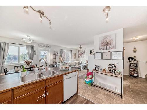 302-800 Yankee Valley Boulevard Se, Airdrie, AB - Indoor Photo Showing Kitchen With Double Sink