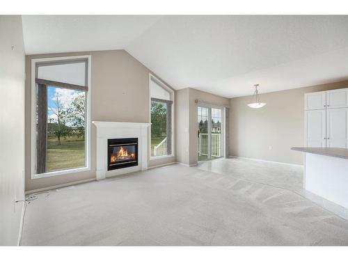 411 Hope Bay, Rural Rocky View County, AB - Indoor Photo Showing Living Room With Fireplace