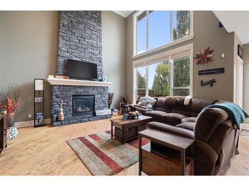 2621 Coopers Circle Sw, Airdrie, AB - Indoor Photo Showing Living Room With Fireplace