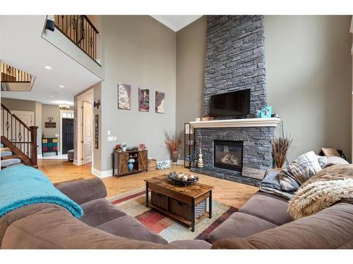 2621 Coopers Circle Sw, Airdrie, AB - Indoor Photo Showing Living Room With Fireplace