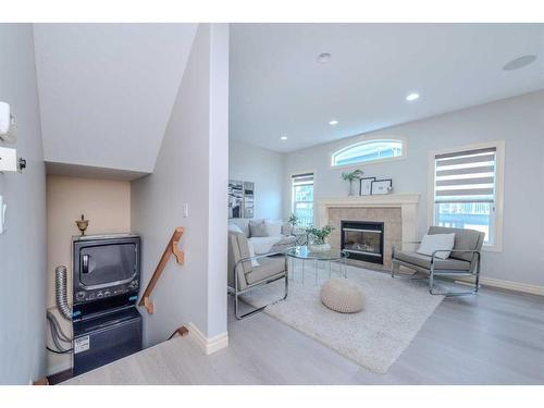 15 Saddleland Drive Ne, Calgary, AB - Indoor Photo Showing Living Room With Fireplace