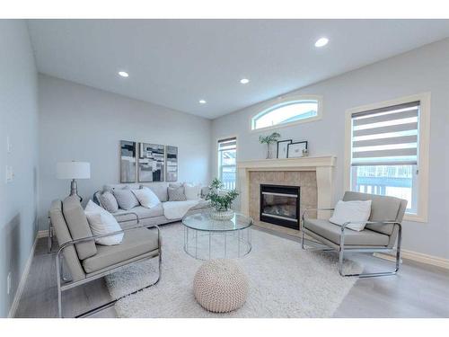 15 Saddleland Drive Ne, Calgary, AB - Indoor Photo Showing Living Room With Fireplace