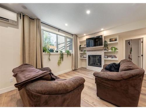 521 18A Street Nw, Calgary, AB - Indoor Photo Showing Living Room With Fireplace