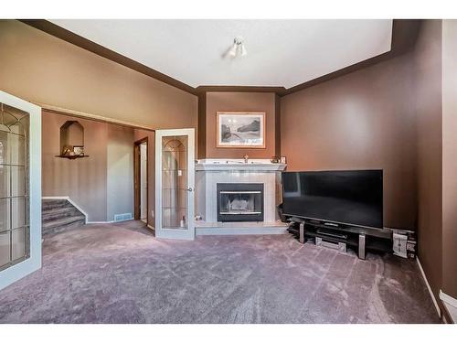 15510 Mckenzie Lake Way Se, Calgary, AB - Indoor Photo Showing Other Room With Fireplace