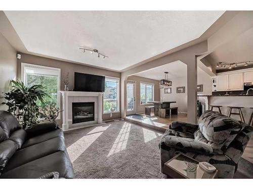 15510 Mckenzie Lake Way Se, Calgary, AB - Indoor Photo Showing Living Room With Fireplace