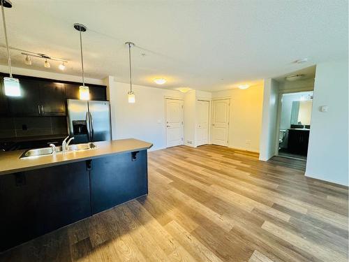 2319-175 Panatella Hill, Calgary, AB - Indoor Photo Showing Kitchen With Double Sink