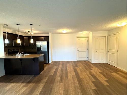 2319-175 Panatella Hill, Calgary, AB - Indoor Photo Showing Kitchen With Double Sink