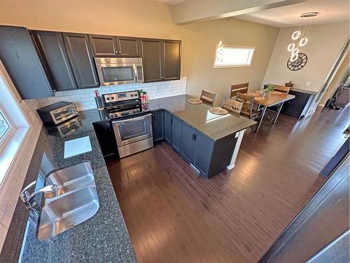 154 Marquis Common Se, Calgary, AB - Indoor Photo Showing Kitchen With Stainless Steel Kitchen