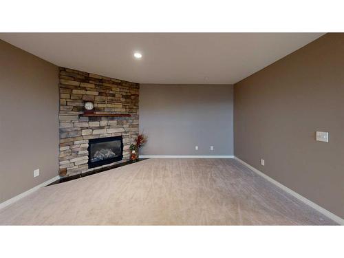 110 Riverside Place Nw, High River, AB - Indoor With Fireplace