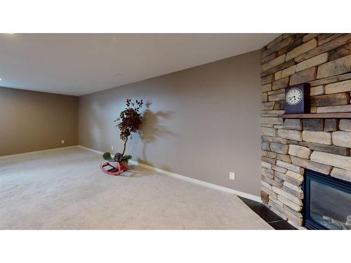 110 Riverside Place Nw, High River, AB - Indoor Photo Showing Other Room With Fireplace