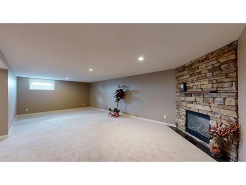 110 Riverside Place Nw, High River, AB - Indoor With Fireplace