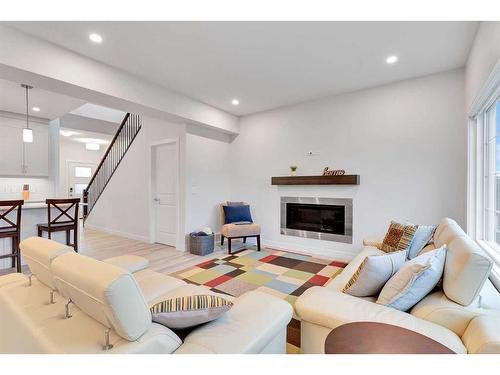 59 Sage Hill Heights Nw, Calgary, AB - Indoor Photo Showing Living Room With Fireplace