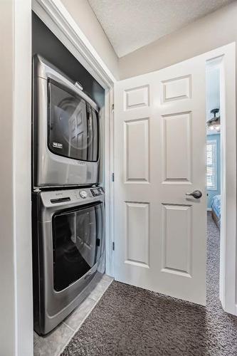 103 Walden Gardens Se, Calgary, AB - Indoor Photo Showing Laundry Room