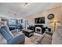 103 Walden Gardens Se, Calgary, AB  - Indoor Photo Showing Living Room With Fireplace 