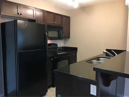 3315-60 Panatella Street Nw, Calgary, AB - Indoor Photo Showing Kitchen With Double Sink