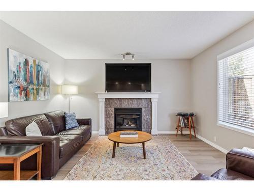 60 Wentworth Close Sw, Calgary, AB - Indoor Photo Showing Living Room With Fireplace