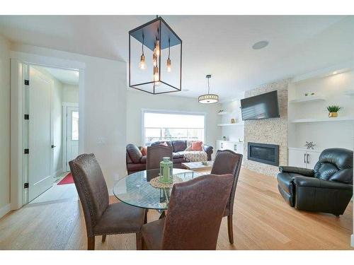 3817 Centre A Street Ne, Calgary, AB - Indoor Photo Showing Dining Room With Fireplace