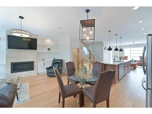 3817 Centre A Street Ne, Calgary, AB - Indoor Photo Showing Dining Room With Fireplace