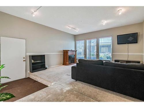 583 Woodpark Crescent Sw, Calgary, AB - Indoor With Fireplace