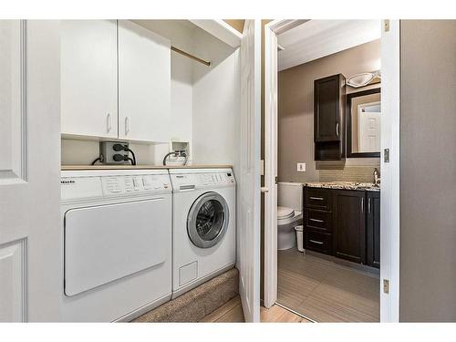 583 Woodpark Crescent Sw, Calgary, AB - Indoor Photo Showing Laundry Room