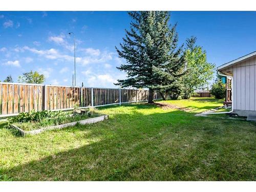 583 Woodpark Crescent Sw, Calgary, AB - Outdoor With Backyard