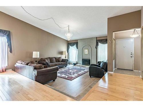 583 Woodpark Crescent Sw, Calgary, AB - Indoor Photo Showing Other Room With Fireplace