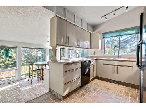 583 Woodpark Crescent Sw, Calgary, AB - Indoor Photo Showing Kitchen With Double Sink