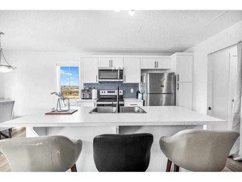 1490 148 Avenue Nw, Calgary, AB - Indoor Photo Showing Kitchen With Stainless Steel Kitchen With Double Sink